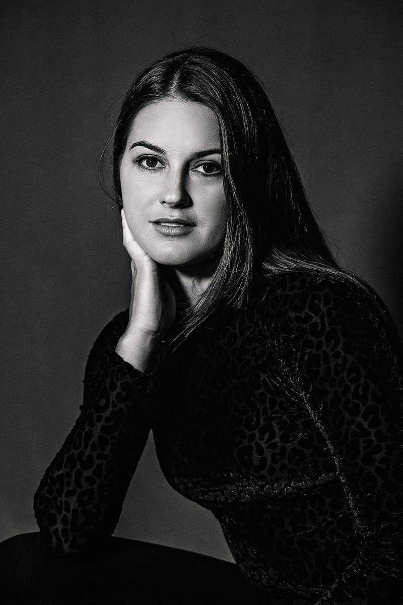 A business owner in a black and white headshot