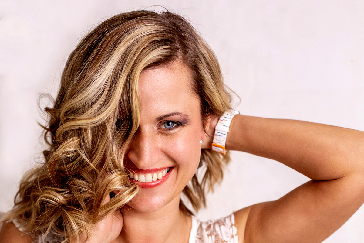 A client with styled hair and a floral crown