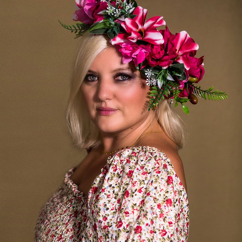 A client in a floral headpiece