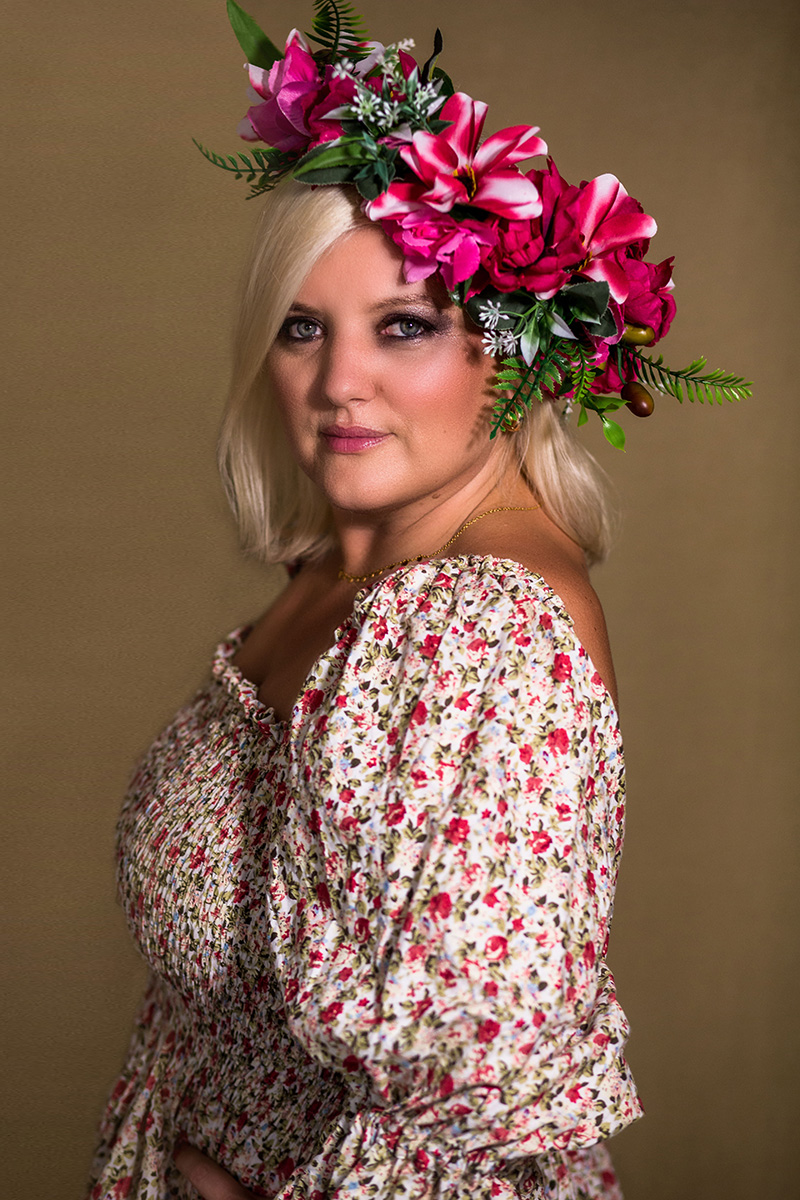 A client in a floral headpiece